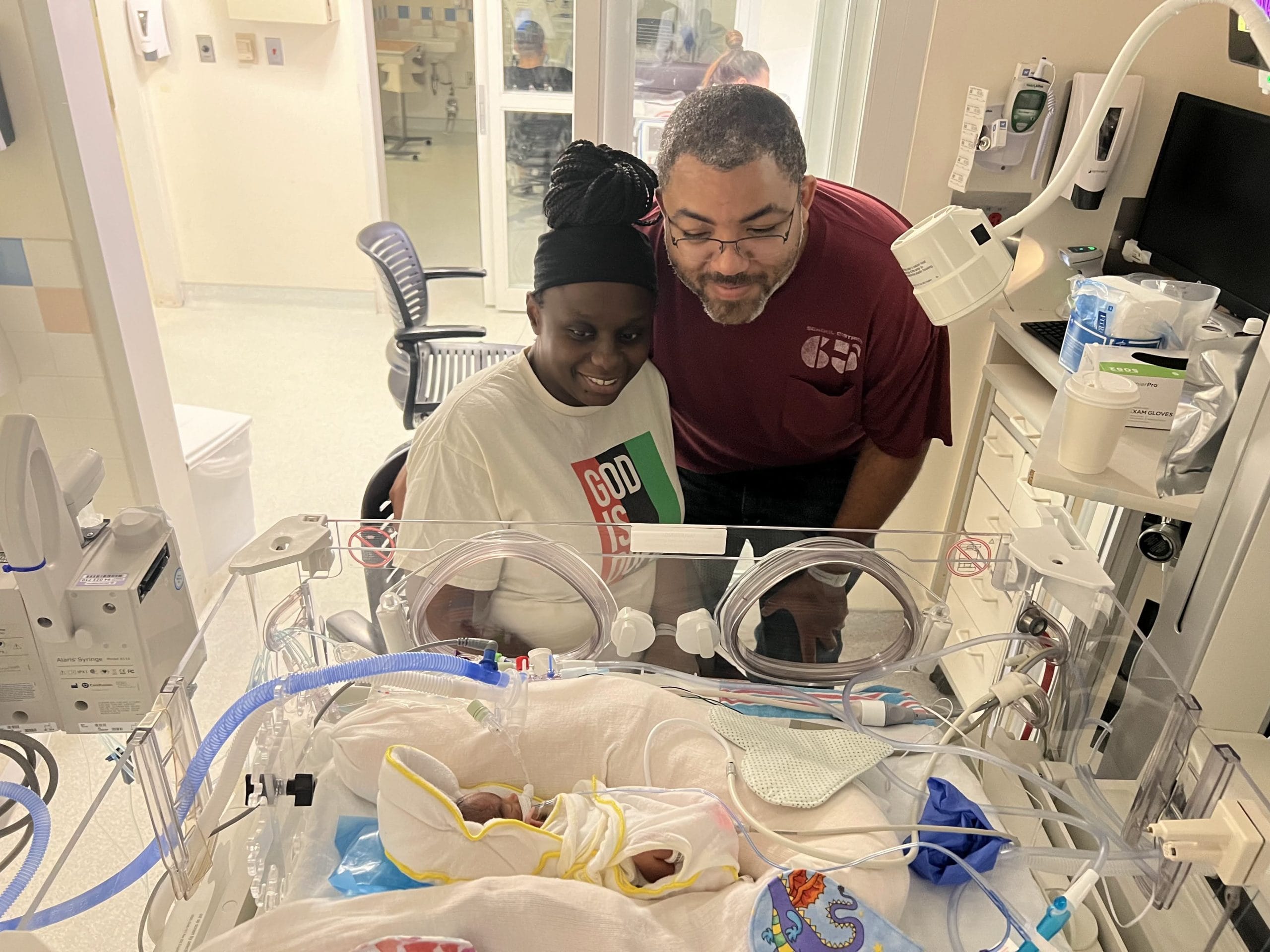 Parents visiting newborn in NICU