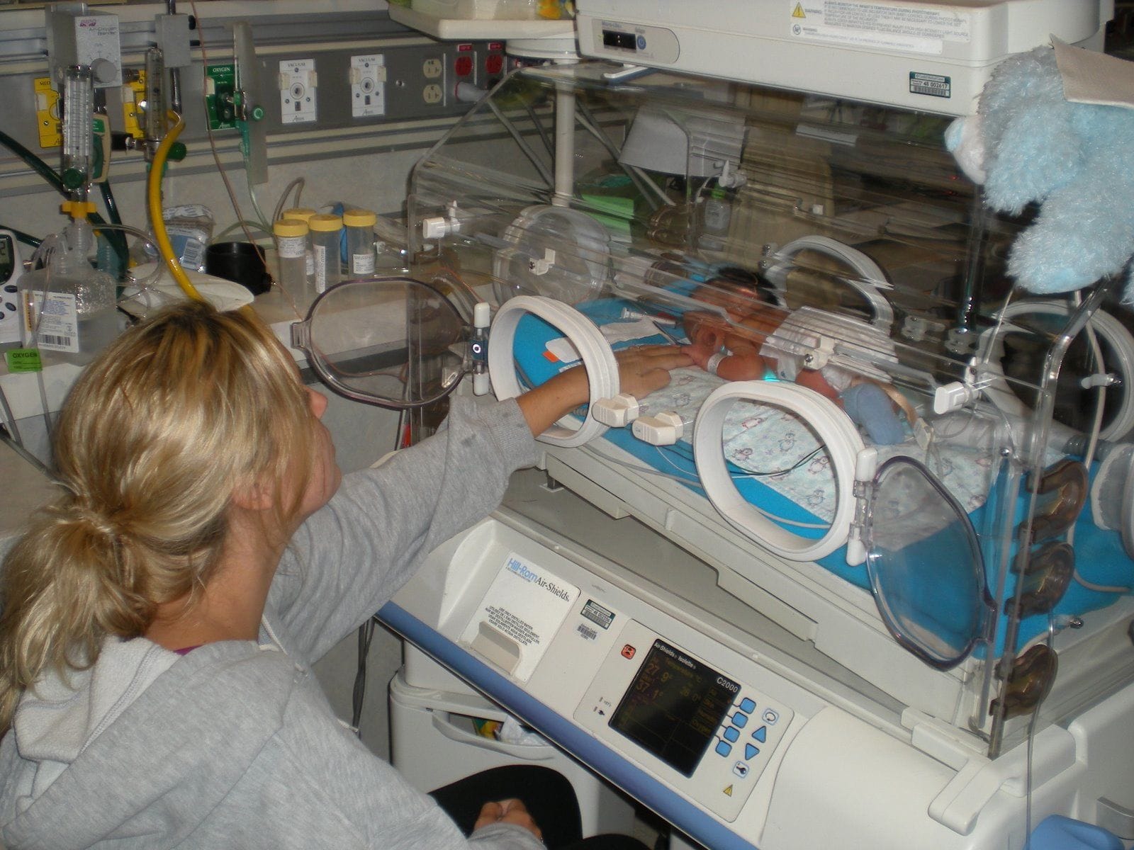 Mother with her newborn baby in NICU