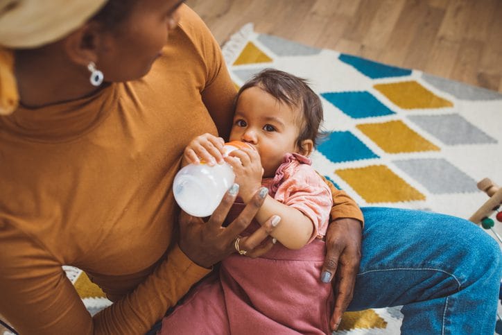Young mother with baby at home Young mother with baby at home